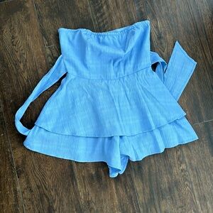 Forever 21 Flowy Romper Size S Blue. Ties in front or back. Zipper in back.
